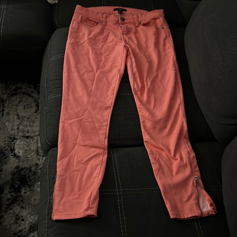 Coral skinny jean with zipper ankle detail